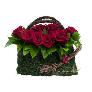 A playful red rose purse arrangement that is perfcet for your loved ones! It includes red roses, coffee beans, and greenery arranged in a metal purse-like basket.