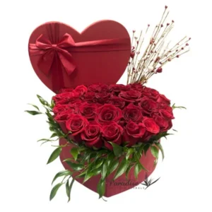Send your love love this Valentine's Day with this red rose heart arrangement!  It includes 3 dozen red roses, greenery, and avante garde heart branches arranged in a red heart box adorned with red ribbon.