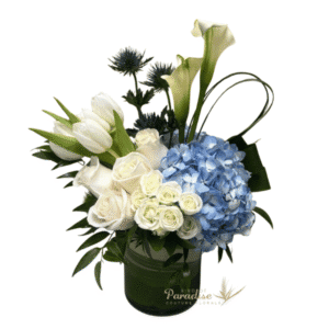 Show your appreciation with this sophisticated flower arrangement that can brighten anyones day. Arranged with hydreangeas, roses, tulips, calla lilies, spray roses and greenery.